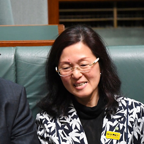 Australian Prime Minister Scott Morrison sits next to Liberal MP Gladys Liu