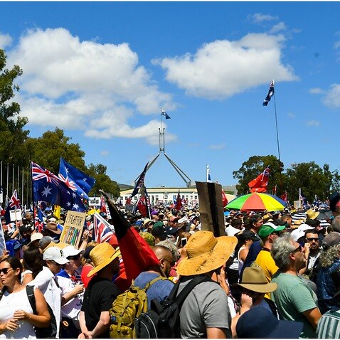 Thousands of people take part in a ‘Convoy to Canberra’ protest outside Parliament House in Canberra, Saturday, February 12, 2022.