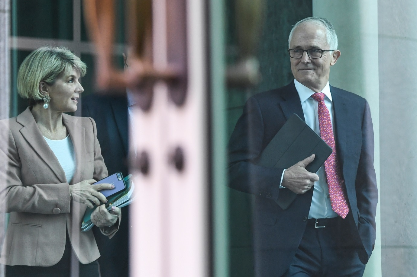 Australian Prime Minister Malcolm Turnbull (right) and Australian Foreign Minister Julie Bishop arrive for a party room meeting