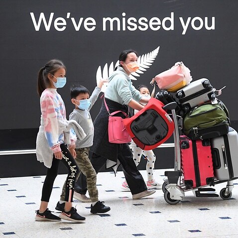 Passengers from New Zealand arrive at Sydney International Airport in Sydney,