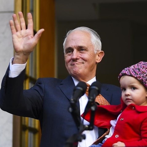 Malcolm Turnbull waves and holds his grand daughter.