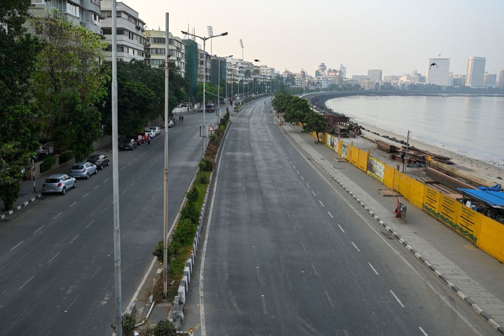 Deserted roads are seen during restrictions imposed by the state government amidst rising COVID-19 coronavirus cases, in Mumbai on 15 April, 2021. 