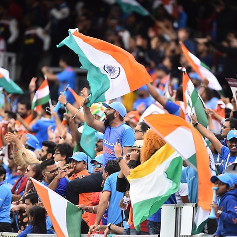 Supporters cheering the Indian cricket team.