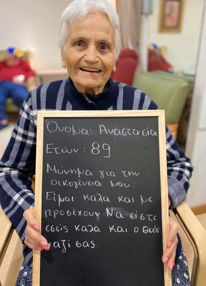 grandma with chalkboard message