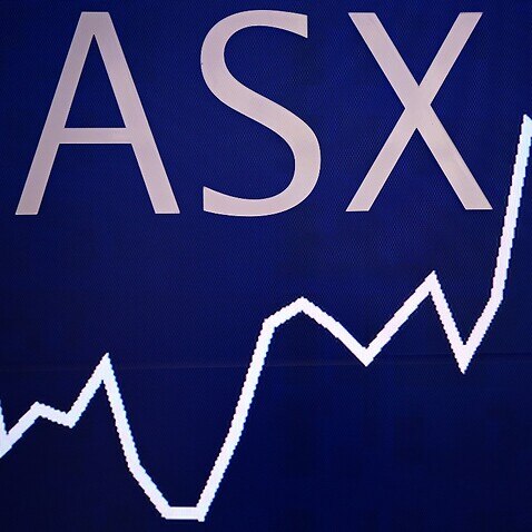 A double exposure showing market boards at the Australian Stock Exchange (ASX) in Sydney. 