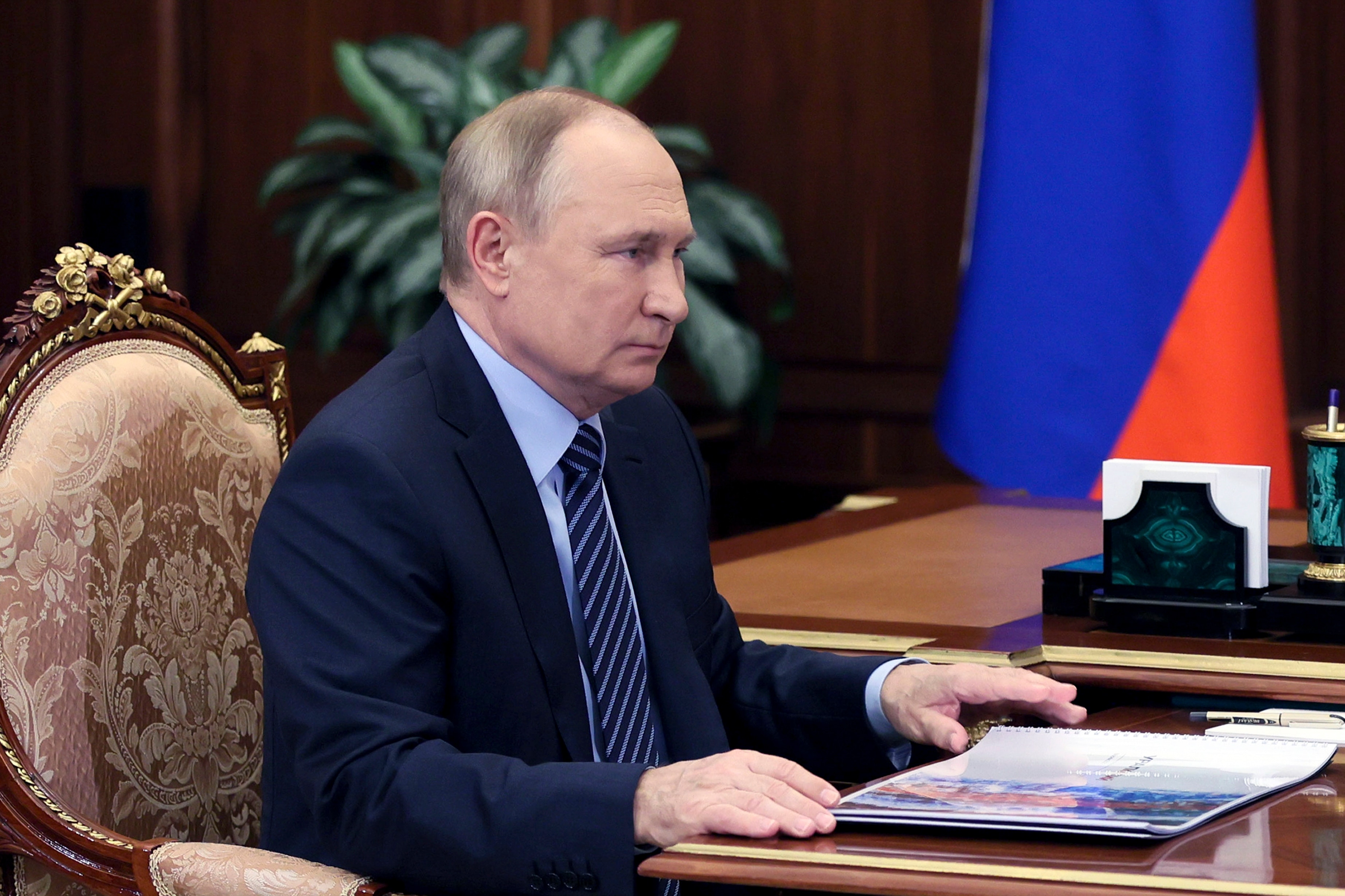 Russian President Vladimir Putin listens during a meeting in the Kremlin in Moscow, Russia, Thursday, January 13, 2022.