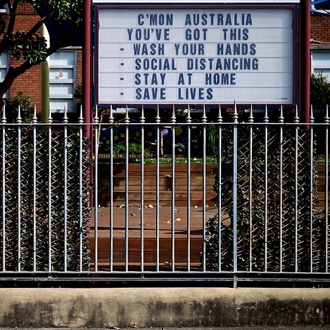 A sign with tips to fight the Coronavirus at a school at Observatory Hill in Sydney