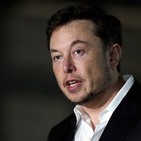 Elon Musk speaks at a news conference in Chicago.