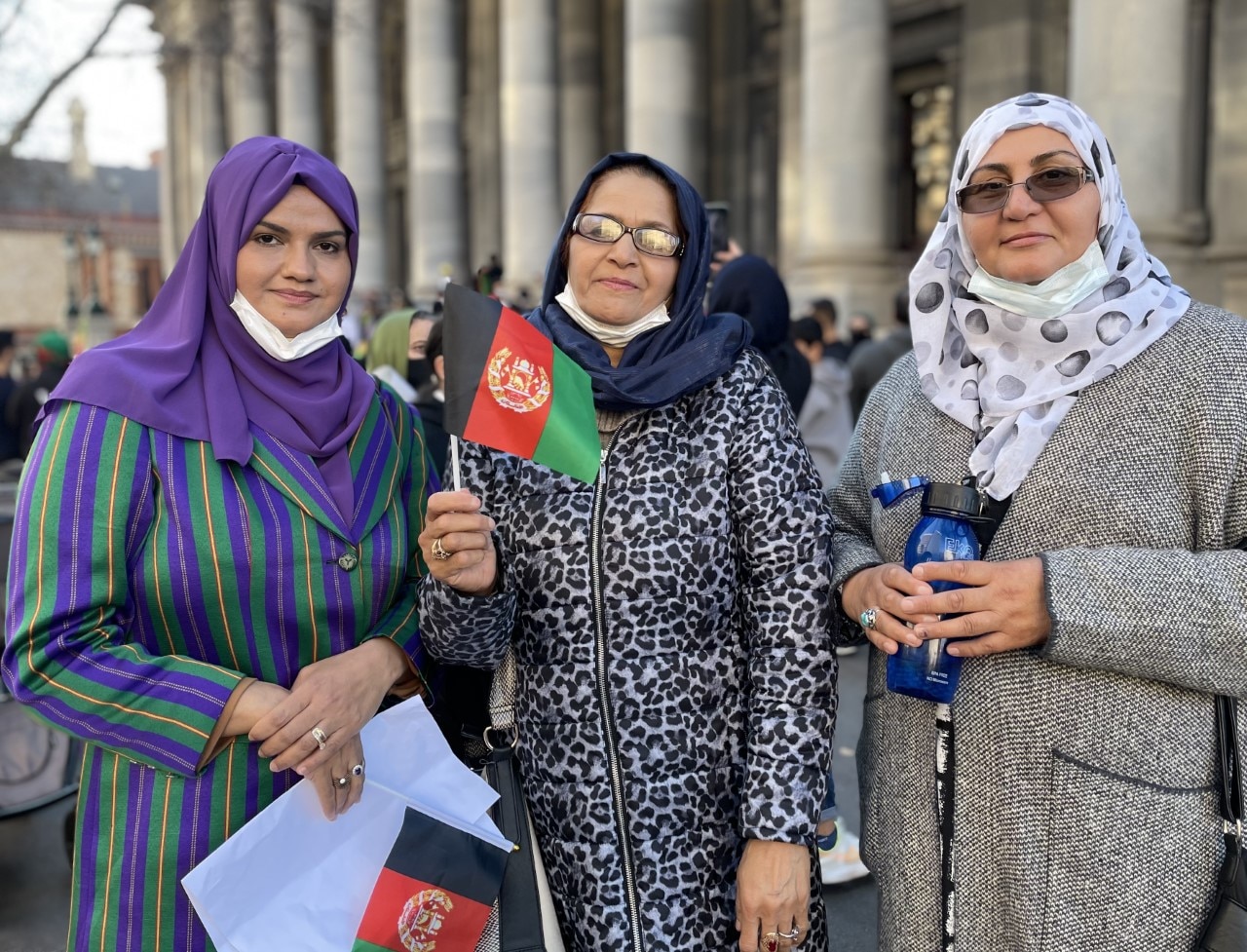 Afghan woman Yalba Siddiqui (left) marched in Adelaide on Saturday