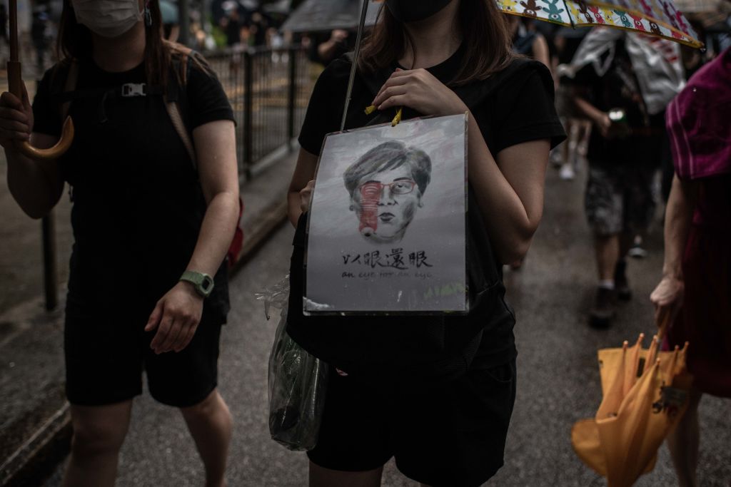 A Badiucao artwork featuring Hong Kong Chief Executive Carrie Lam and the caption: an eye for an eye.