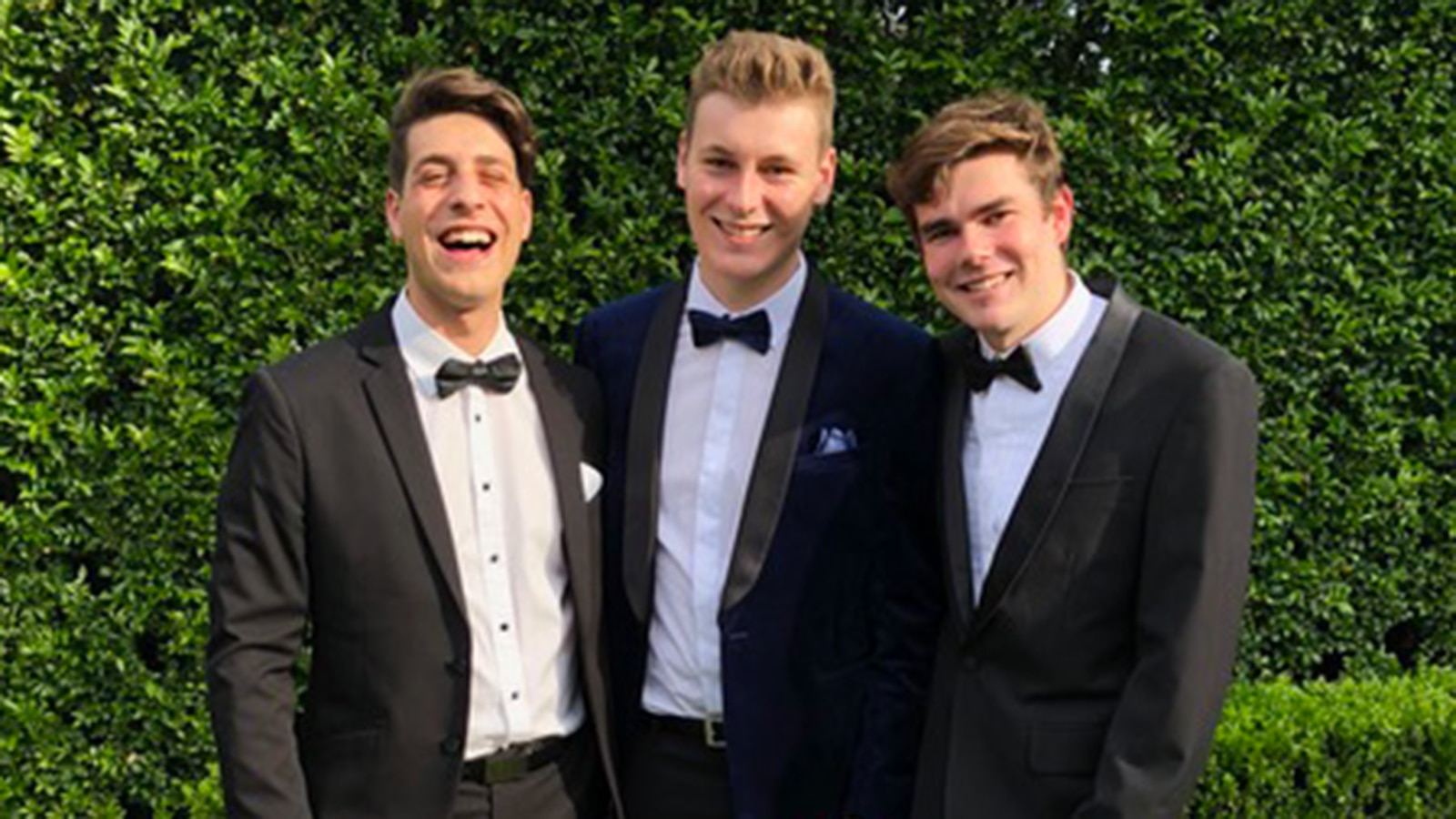 Finn, centre, with his boyfriend Tom Moiso, left, and a friend at his school formal. 