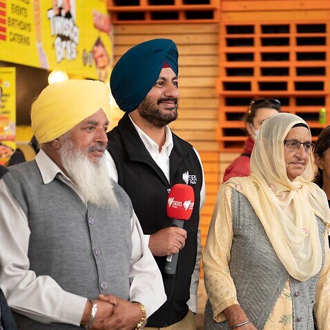 SBS Punjabi's Preetinder Grewal and Paras Nagpal with Punjabi community members at the Dandenong Election Exchange.