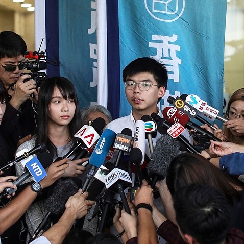 Joshua Wong talks to the press last month after being released on bail.
