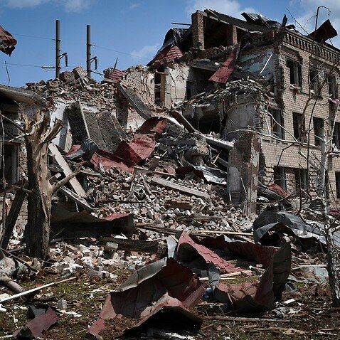 Destroyed houses are seen after Russian shelling in Soledar, Donetsk region, Ukraine, Tuesday, May 24, 2022. (AP Photo/Andriy Andriyenko)