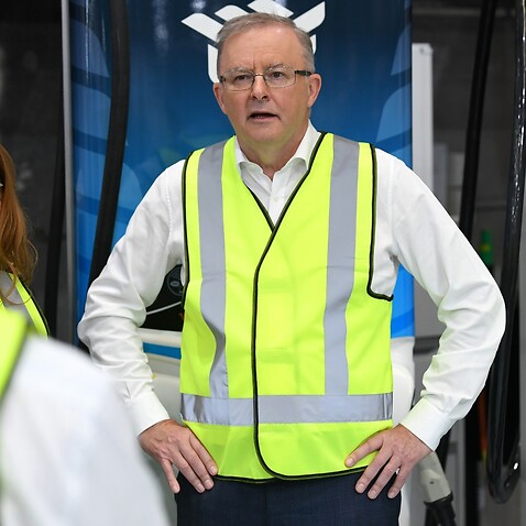 Leader of the Opposition, Anthony Albanese (centre) is seen during a tour of the Tritium factory in Brisbane, Wednesday, February 10, 2021. 