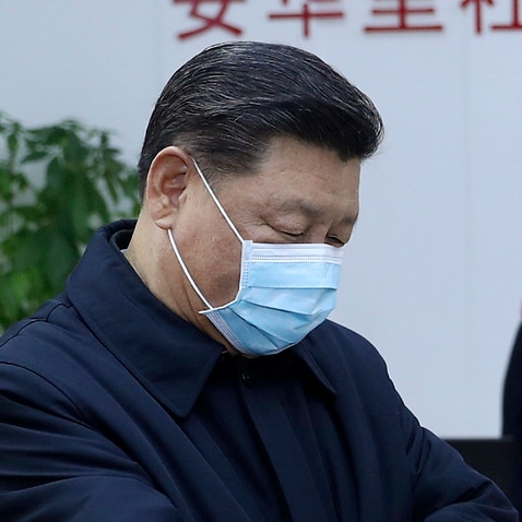 Chinese President Xi Jinping  receives a temperature check as he inspects the coronavirus pneumonia prevention and control work at a neighbourhoods in Beijing