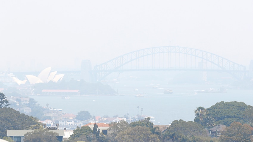 Smoke haze from wildfires fills the skyline in Sydney, Tuesday, Dec. 3, 2019. The annual Australian fire season normally peaks during the Southern Hemisphere summer, but has started early after an unusually warm and dry winter. (AP Photo/Rick Rycroft)