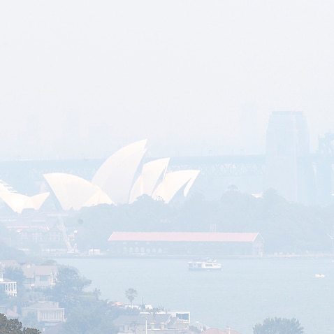 Smoke haze from wildfires fills the skyline in Sydney, Tuesday, Dec. 3, 2019. The annual Australian fire season normally peaks during the Southern Hemisphere summer, but has started early after an unusually warm and dry winter. (AP Photo/Rick Rycroft)