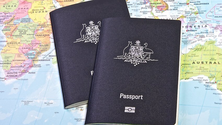 Two passport on a map of the world