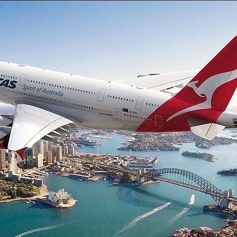 Qantas plane flying over Sydney