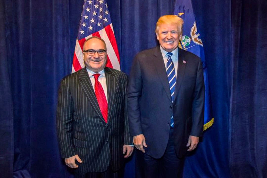 George Nader, left, with Donald Trump, backstage at an RNC fundraiser in Dallas in October 2017. 