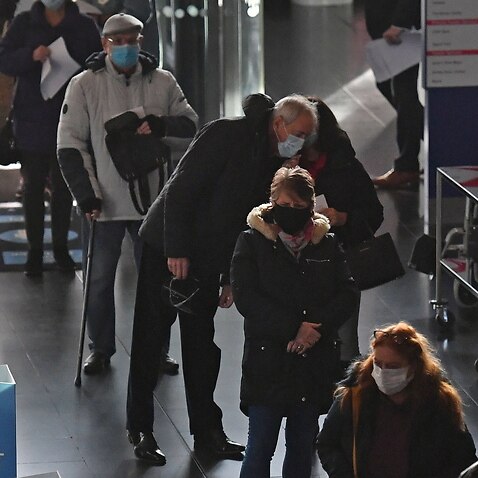 People queuing to receive an injection of a COVID-19 vaccine at the NHS vaccine centre in Birmingham, UK, 11 January 2021.