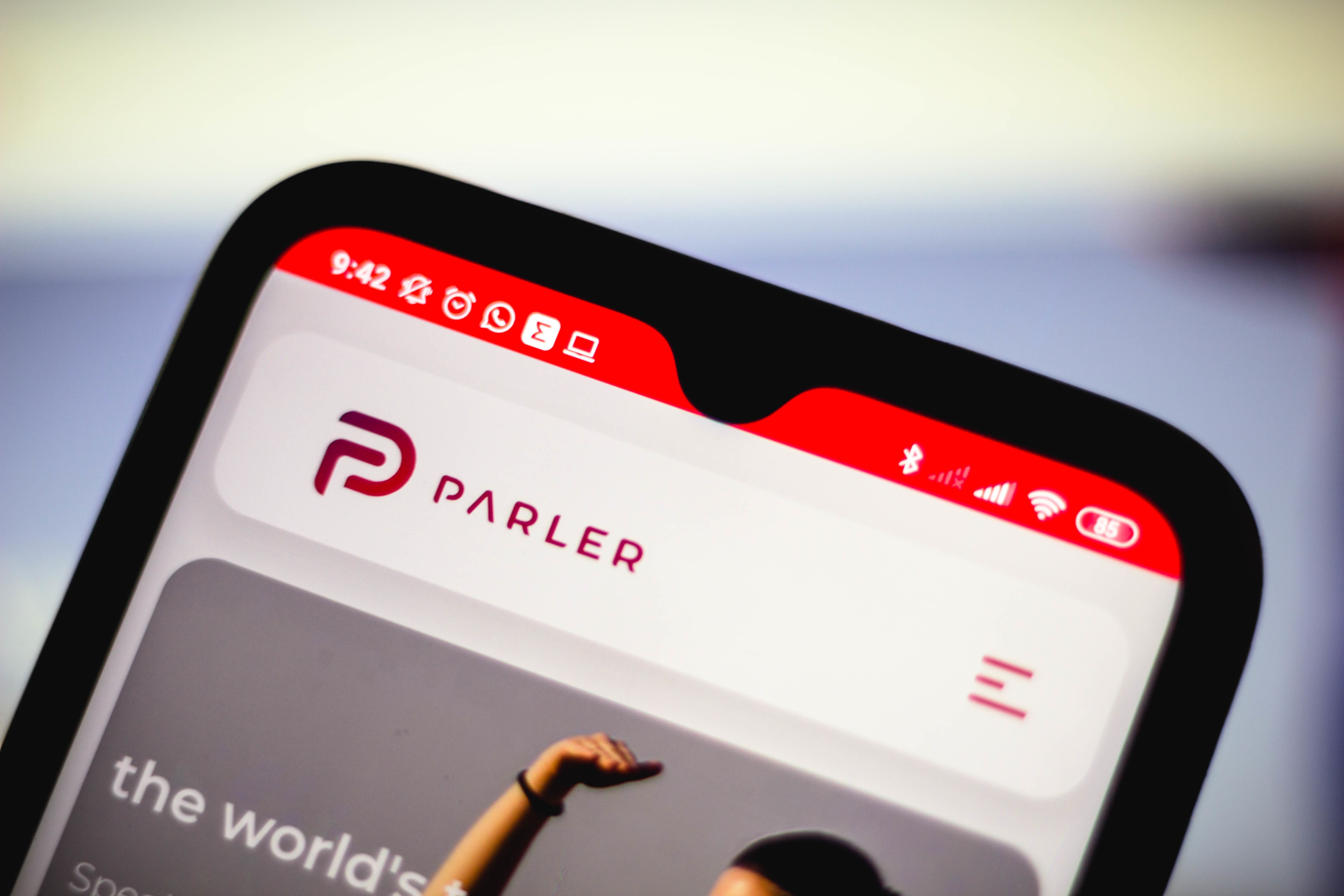 The Parler logo is seen displayed on a smartphone.