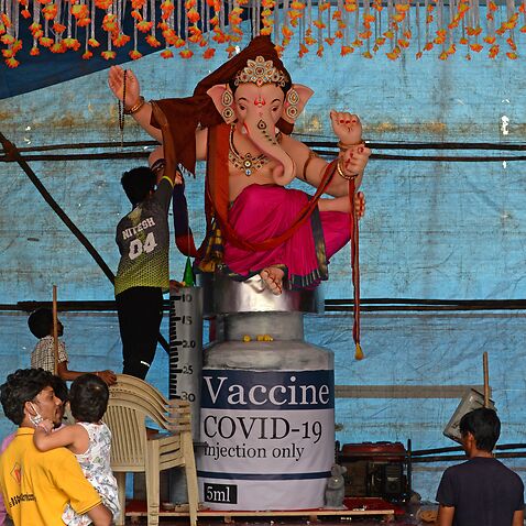 Devotees prepare for the Ganesh Chaturthi festival in Mumbai.