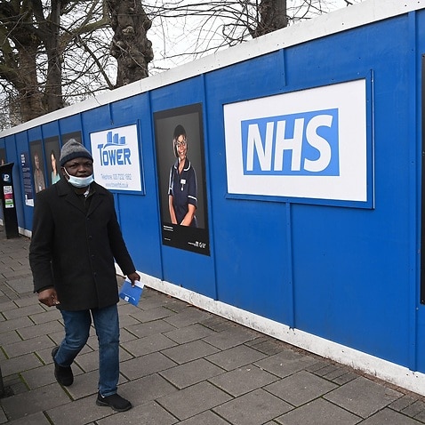 A man passes a temporary 'Nightingale' field hospital in South London