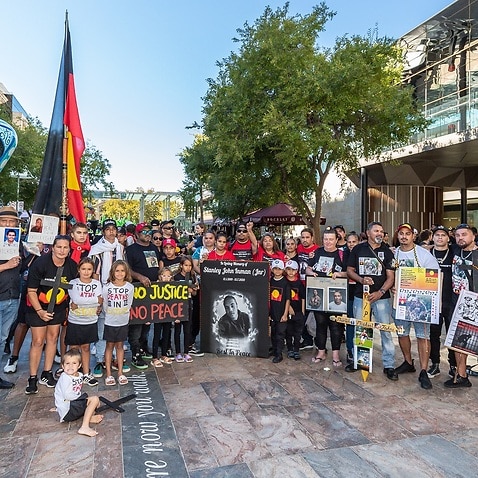 Protesters are seen during a Stop Black Deaths in Custody rally in Perth, Thursday, April 15, 2021. The protests mark the 30th anniversary of the Royal Commission into Aboriginal Deaths in Custody, which handed down its final report on April 15, 1991.