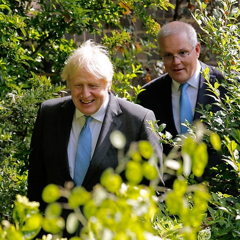 Boris Johnson and  Scott Morrison depart  following a news conference during their bilateral meeting at 10 Downing Street in London, Britain, 15 June 2021. 