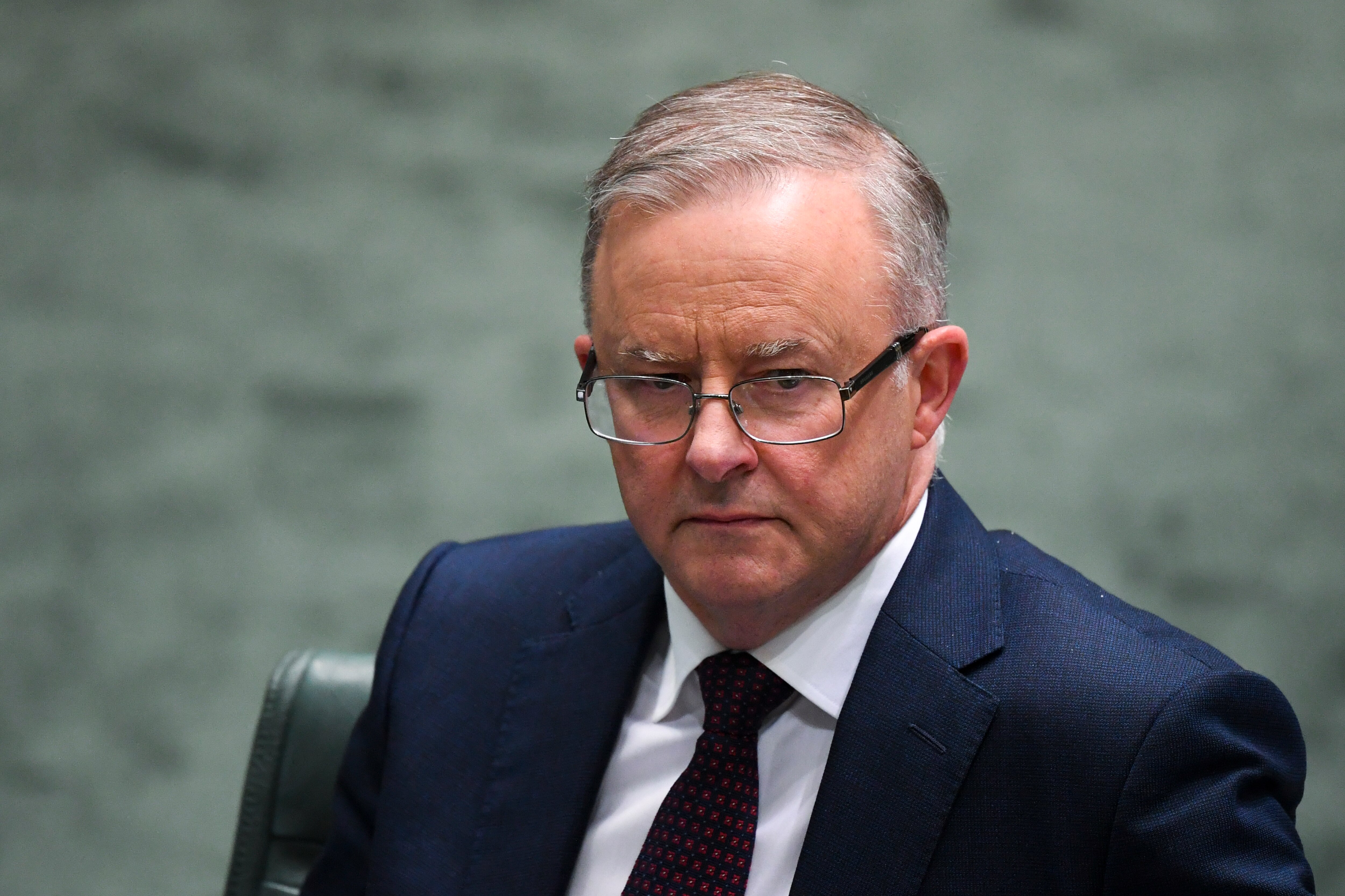 Opposition Leader Anthony Albanese reacts during House of Representatives Question Time at Parliament House in Canberra.