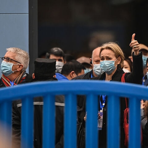 Thea Fisher (C) and other members of the World Health Organization (WHO) team, investigating the origins of the COVID-19 coronavirus, visit the closed Huanan Seafood wholesale market in Wuhan.