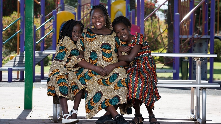 Disability advocate Esther Simbi with her two children in Adelaide.