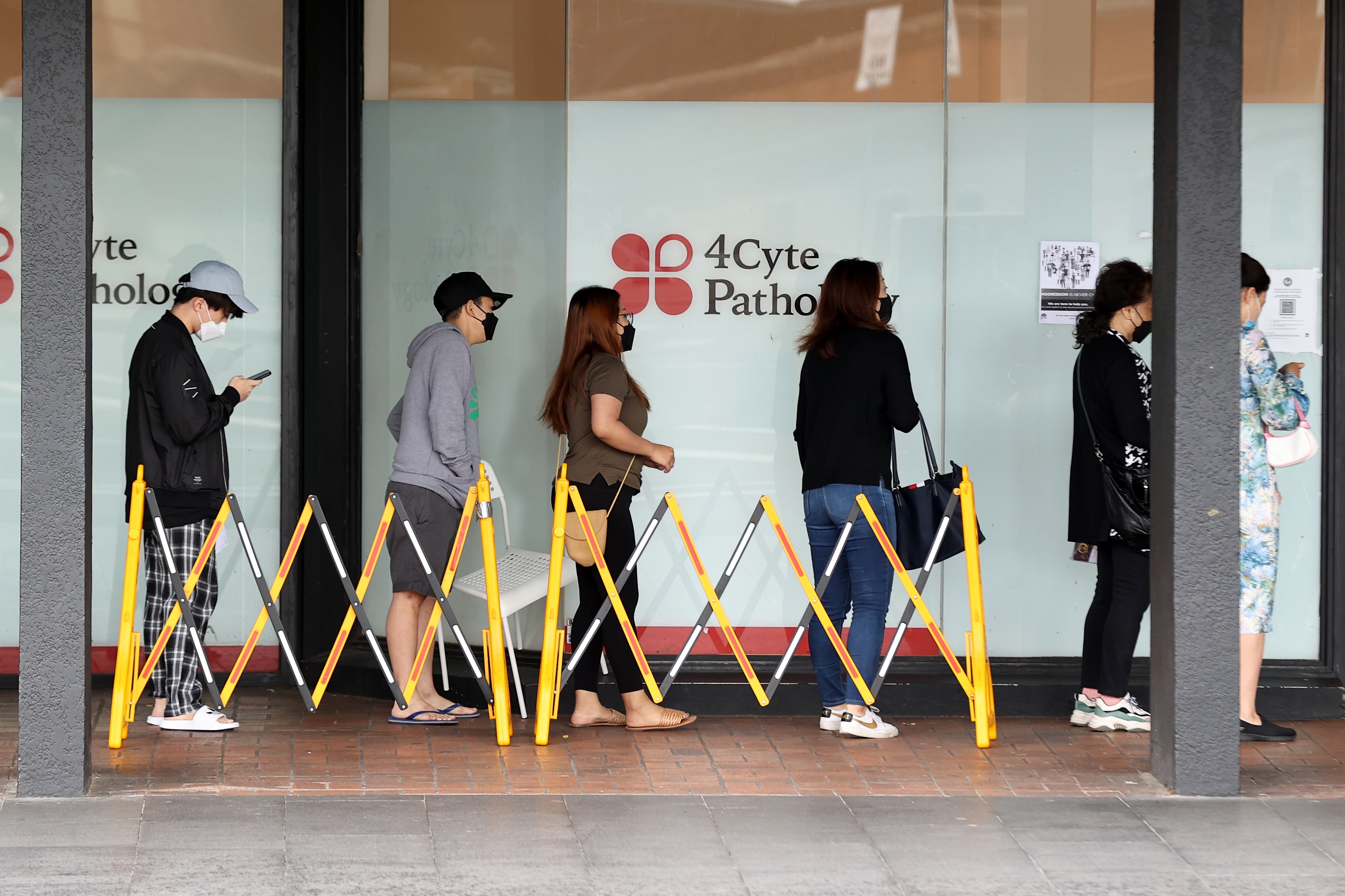 Members of the public queue to take Covid-19 PCR tests in Sydney's CBD