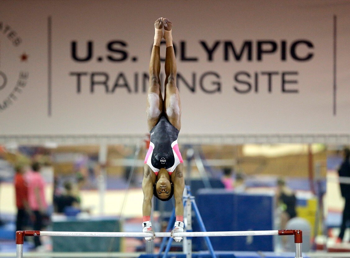 In this Sept, 12, 2015 photo, U.S. gymnast Gabby Douglas trains during a Karolyi Ranch nearby New Waverly, Texas. 