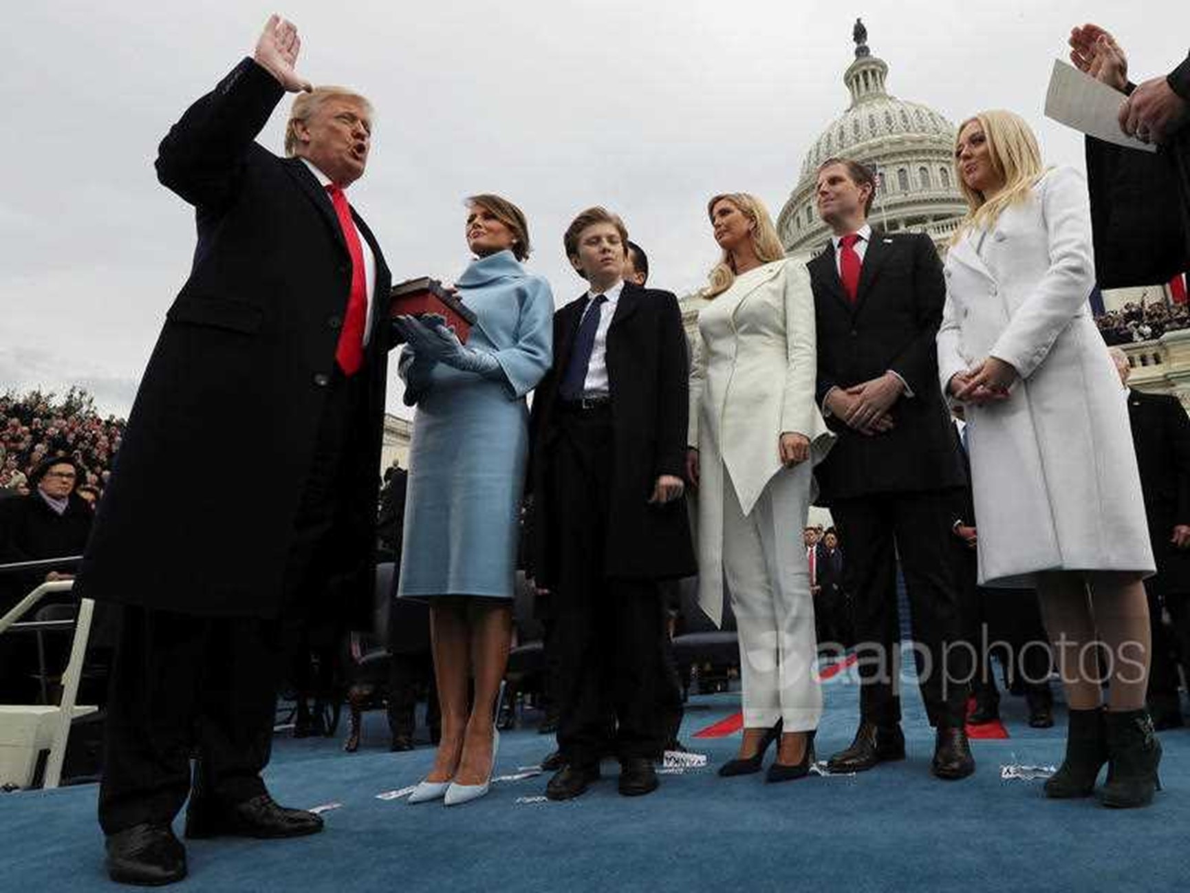 President Donald Trump takes the oath of office from Chief Justice John Roberts, as his wife Melania holds the bible, and with his children Barron, Ivanka, Eric and Tiffany, Friday, Jan. 27, 2017 on Capitol Hill in Washington. 