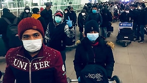 Bangladeshi citizens wear face masks as they prepare to evacuate Wuhan.