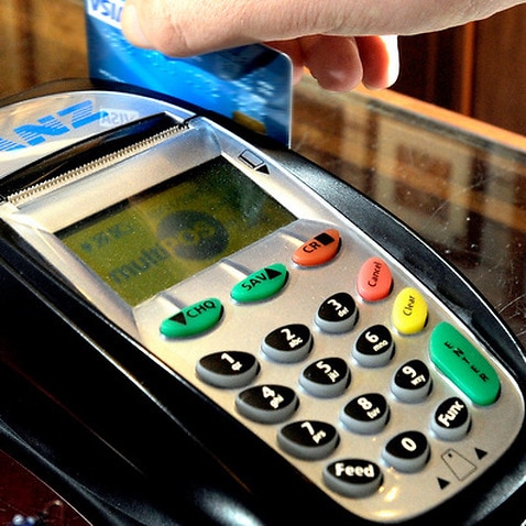 A debit card being swiped through an EFTPOS machine in Canberra 