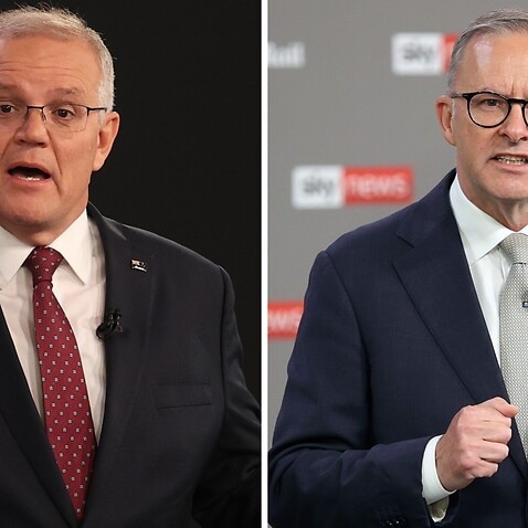 A comparison diptych shows (left) Australian Prime Minister Scott Morrison and (right) Australian Opposition Leader Anthony Albanese speaking during the first leaders' debate of the 2022 federal election hosted by Sky News at the Gabba in Brisbane, Wednes