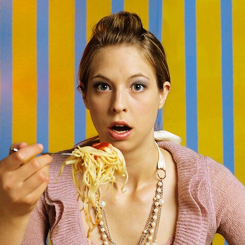 Woman eating spaghetti