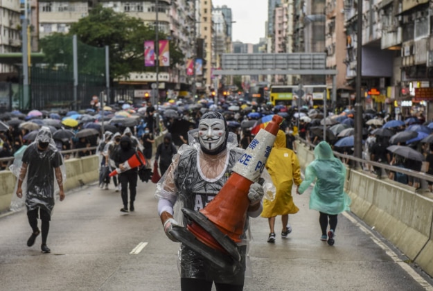 Protesters in Hong Kong during a demonstration against a new law banning face masks in public AAP