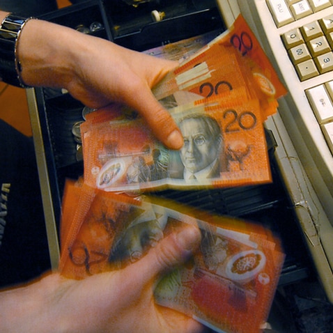 Money removed from a till Canberra, Thursday, July 12,  2007.  (AAP Image/Alan Porritt) NO ARCHIVING