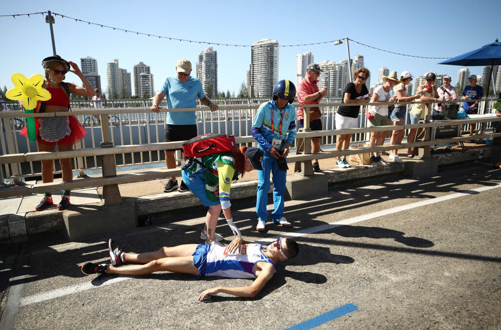 Callum Hawkins of Scotland collapses in the Men's marathon on day 11 of the Gold Coast 2018 Commonwealth Games.