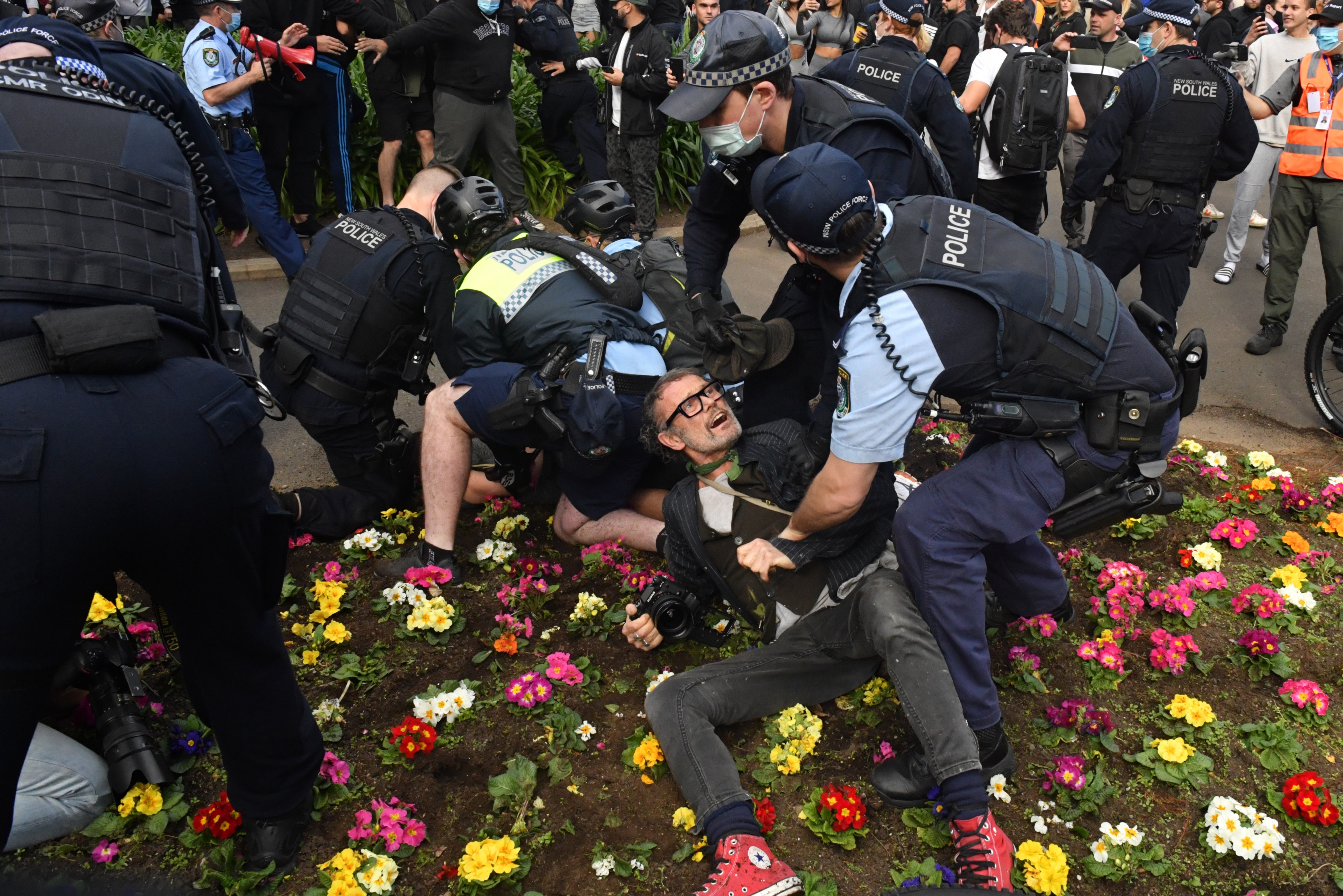 Protesters are arrested by police at Victoria Park on Broadway during the â€˜World Wide Rally For Freedomâ€™ anti-lockdown rally at Hyde Park in Sydney, Saturday, July 24, 2021. (AAP Image/Mick Tsikas) NO ARCHIVING