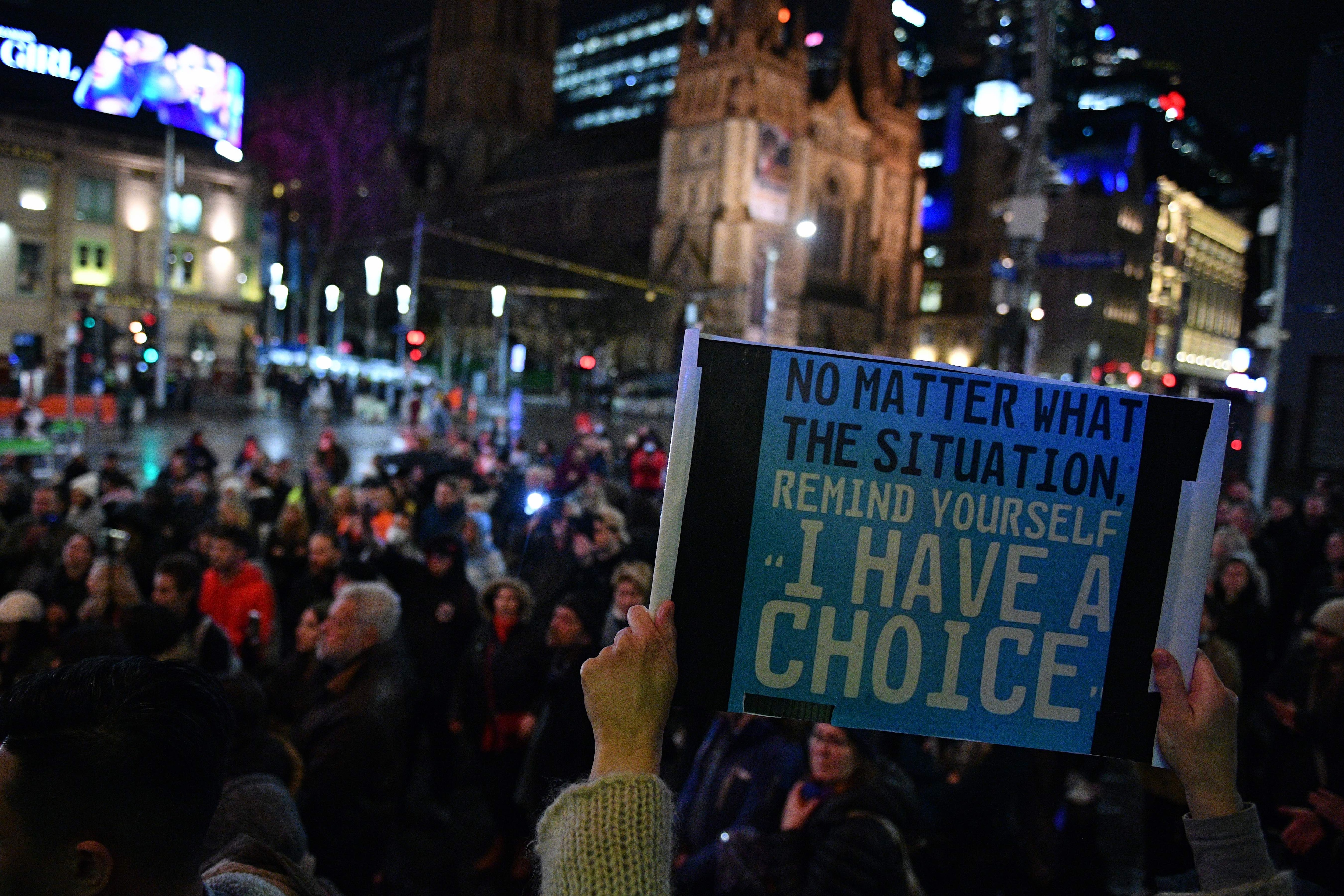 Anti-lockdown protestors are seen during a protest in the Melbourne CBD.