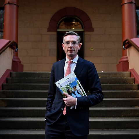 Treasurer Dominic Perrottet poses for a photo outside the NSW Parliament in Sydney, Monday, June 21, 2021. (AAP Image/Joel Carrett) NO ARCHIVING