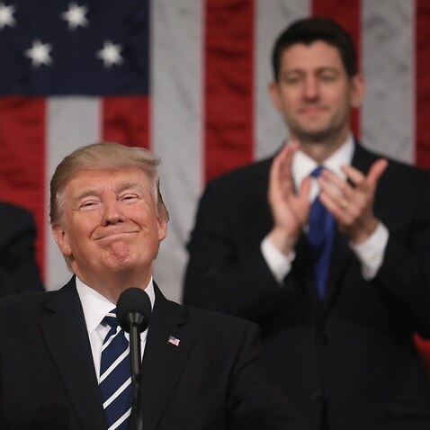  Vice President Mike Pence (L) and Speaker of the House Paul Ryan (R) applaud as US President Donald J. Trump (C) delivers his first State of the Union address