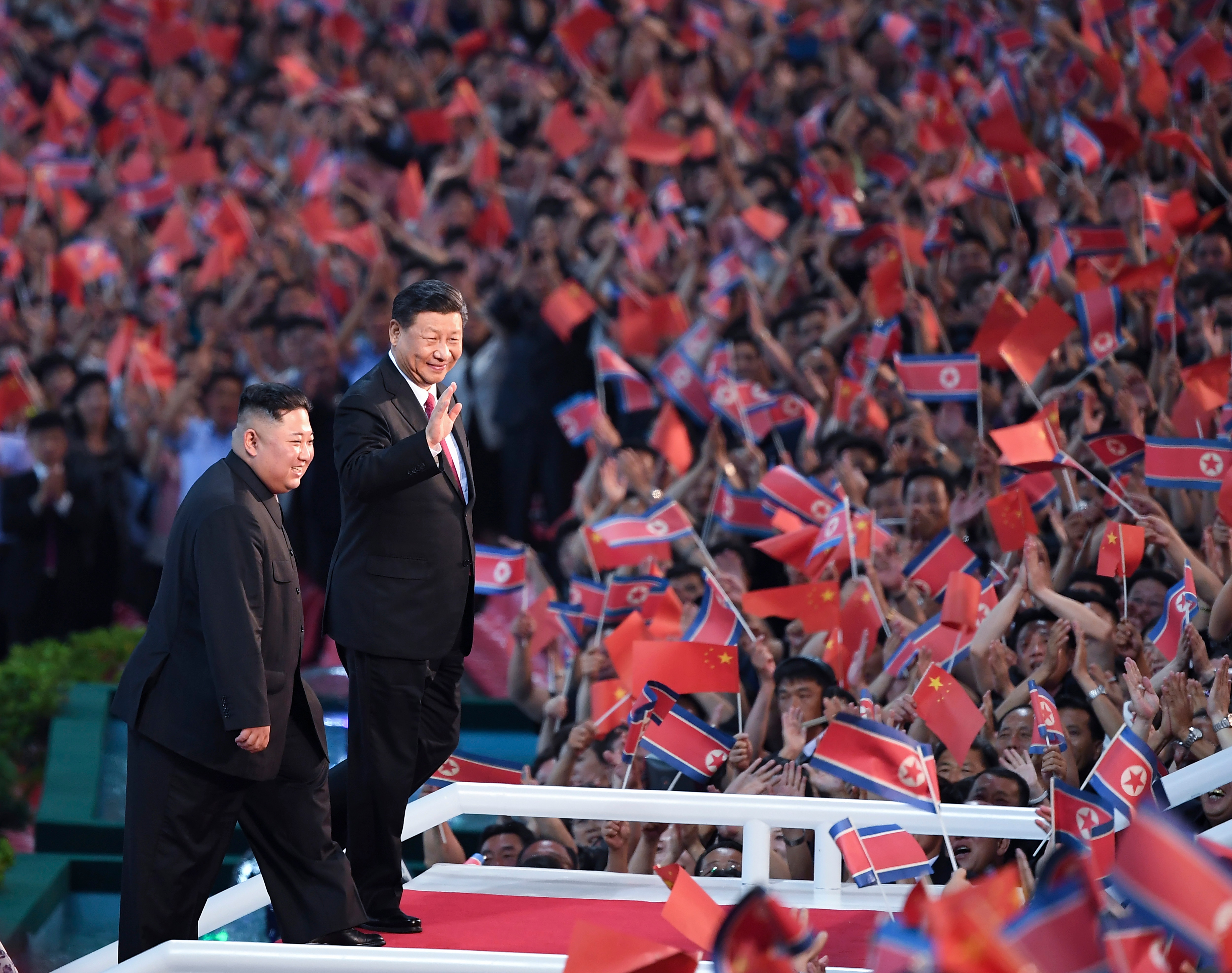 North Korean leader Kim Jong Un and visiting Chinese President Xi Jinping attend a mass gymnastic performance at the May Day Stadium in Pyongyang, North Korea.