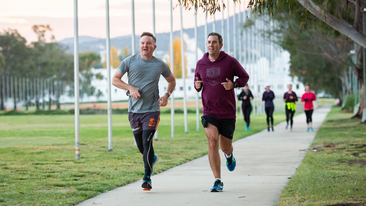 Shadow treasurer Chris Bowen and Shadow Minister for Finance Jim Chalmers on a run outside parliament house in Canberra.  